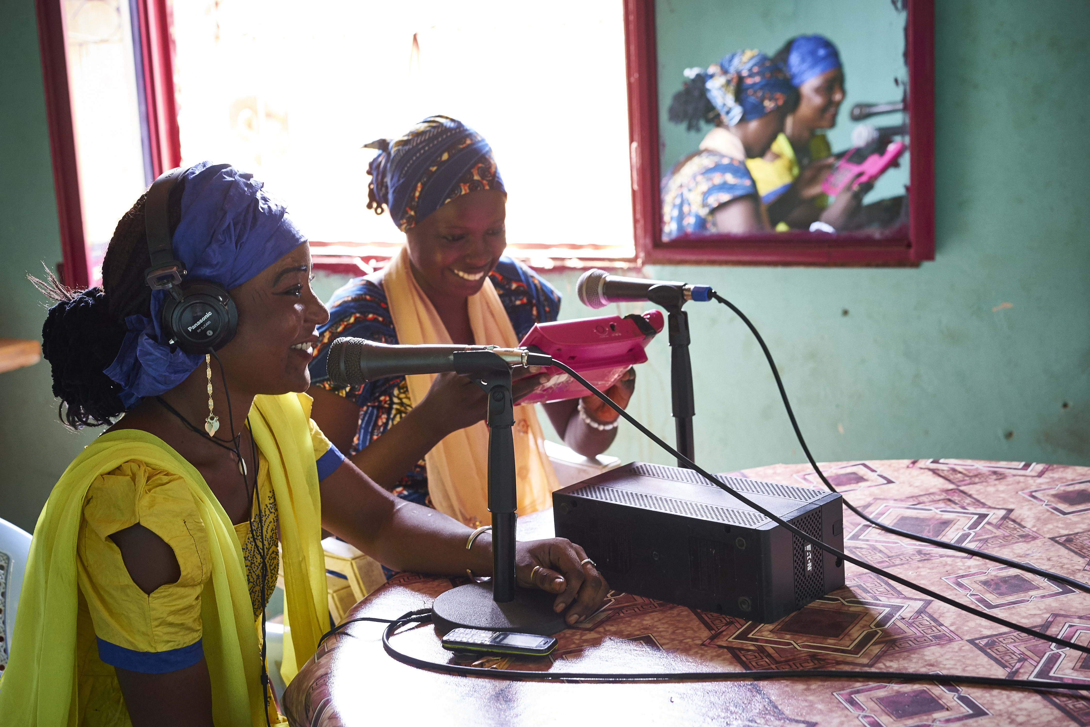 Two women talk live during a Radio Canal Esperance program