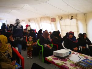 Female IDPs attend Al Shahama Camp's International Women's Day celebration.