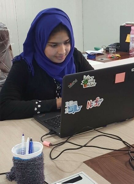 Anaam using a computer in the Community Technology Access center