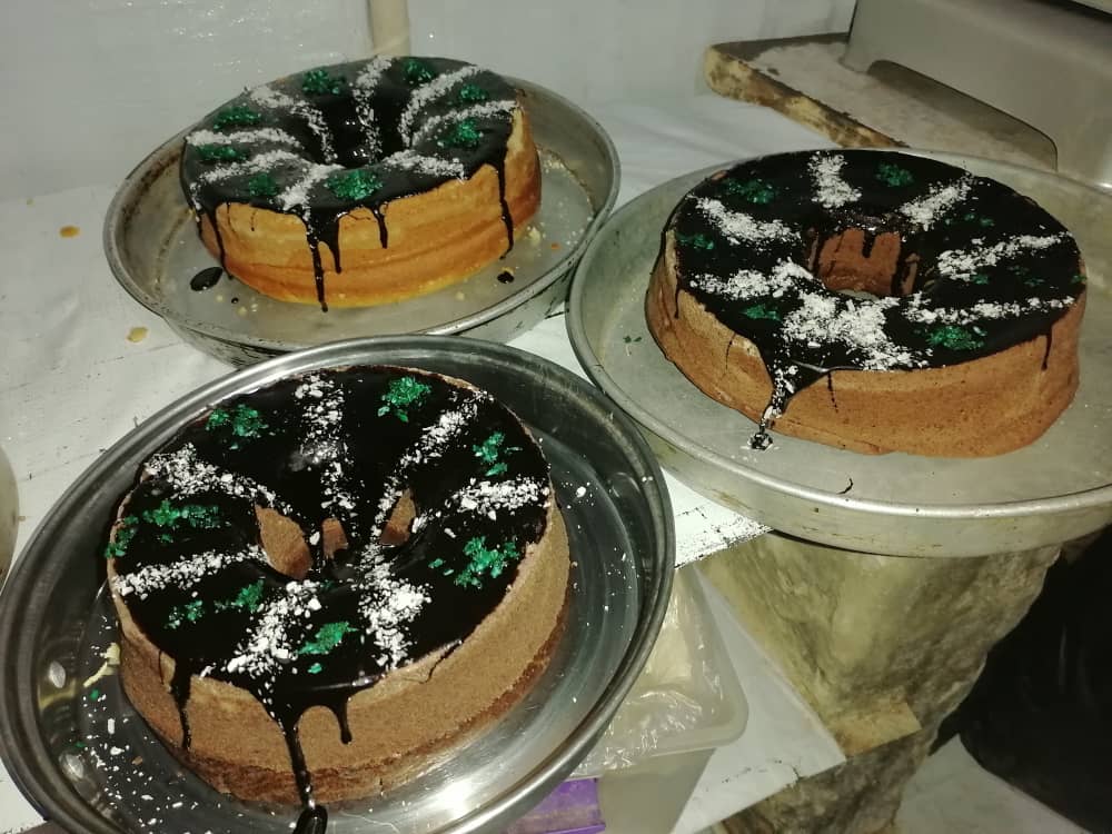 three cakes with decorative icing