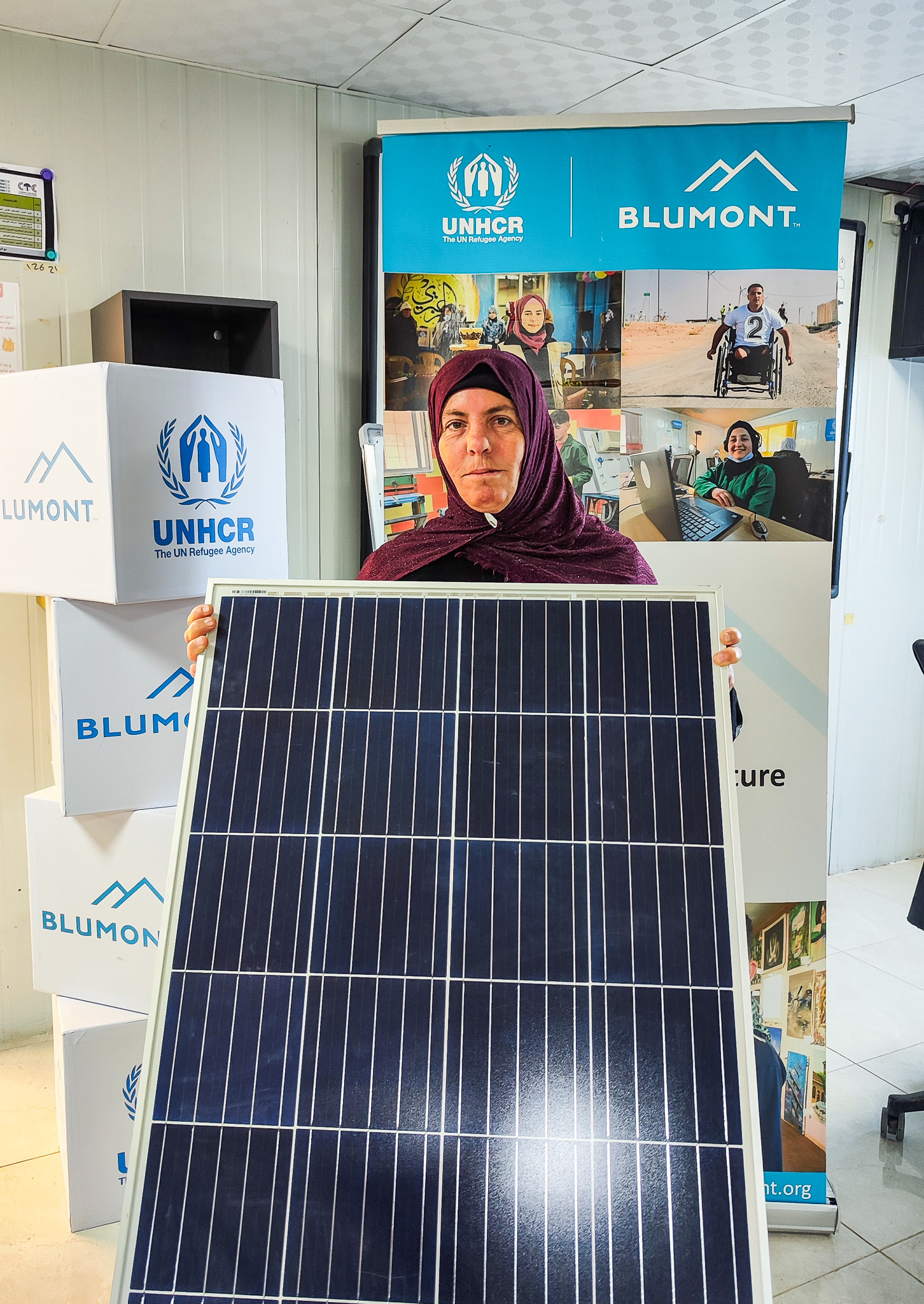 woman holding panel for solar energy